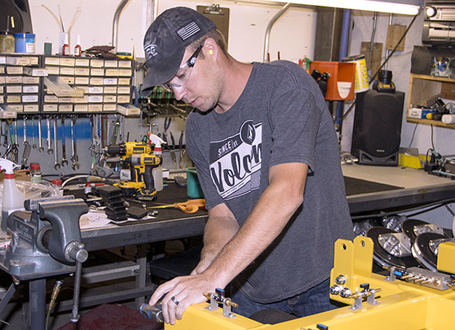 Frame assembly technician at work.