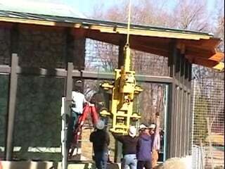 Wood's Powr-Grip Lifter Installs Glass at Zoo Bear Enclosure