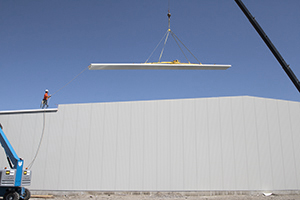 Flying 55 foot roof insulated panel at Wood's Powr-Grip.